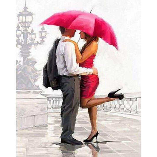 Man and woman with red umbrella