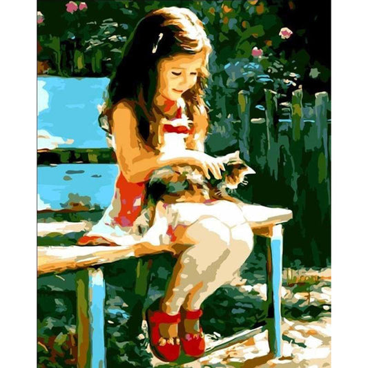 Little Girl in the park with her cat