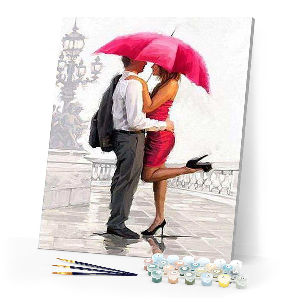 Man and woman with red umbrella