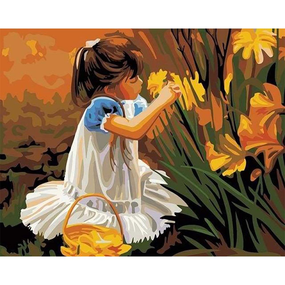 Little girl picking flowers