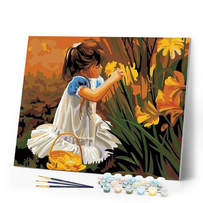 Little girl picking flowers