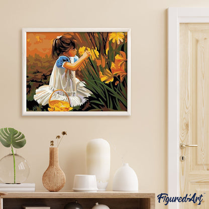 Little girl picking flowers